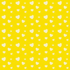 Valentines day pattern with many hearts from white rose petals on yellow background