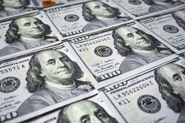 Hundred Dollar Banknotes close-up as background with shallow depth of field