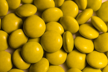 Fototapeta premium Close up a colorful candies of chocolates with yellow colors