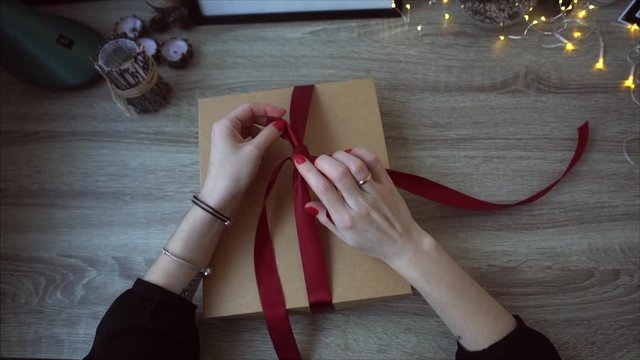 Young Woman Wrapping Christmas Gifts