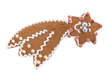 Handmade Christmas gingerbread comet on wooden background