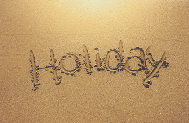 written holiday on the sand