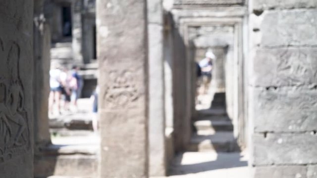 Closeup steadicam motion of apsara dancers on a column in the Banteay Kdei temple ruins.