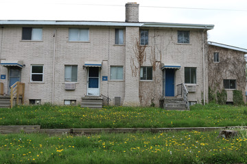  Low income housing with uncut grass and weeds.  Many units are abandoned. - 188932767
