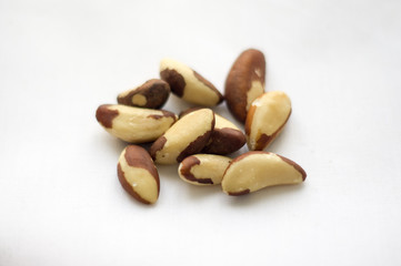 Raw Brazil nuts on the white background
