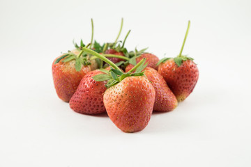 Close up of the strawberries on the white background.