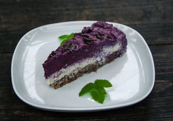 Piece of blueberry vegan cake the white plate