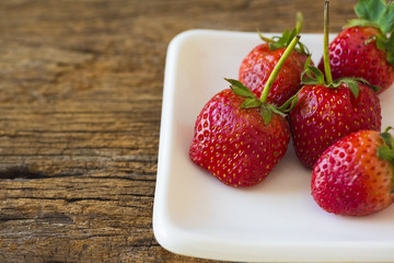 Delicious strawberries in the white plate
