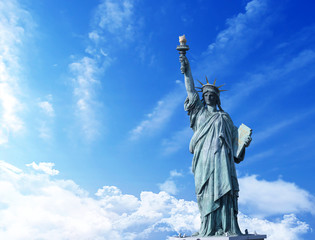 Fototapeta premium Statue of Liberty with clouds background 