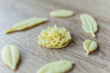 White chocolate ornaments. Flower, feathers and leaves molds.