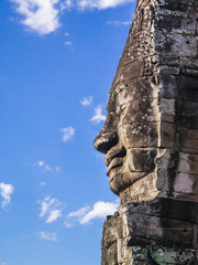 Fototapeta na wymiar Profile of smiling stone Buddha face at Bayon temple, Angkor Thom, Siem Reap, Cambodia 