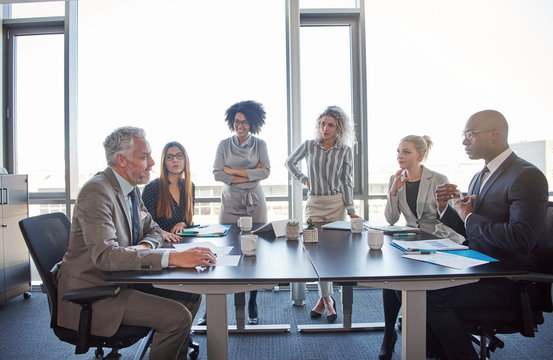 Diverse Coworkers Meeting Together In A Boardroom In An Office