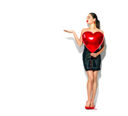 Valentine's Day. Beauty girl with red heart shaped air balloon, isolated on white background