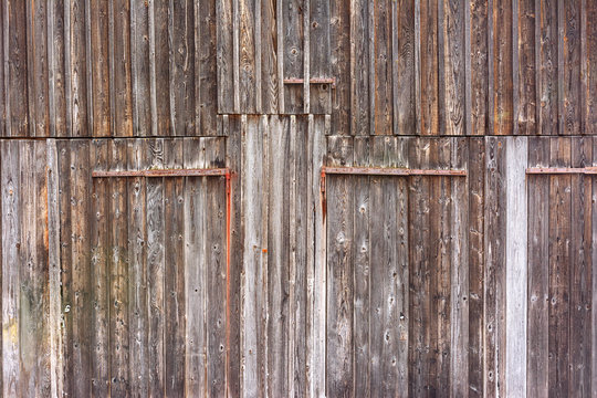 Background structure - Old door of barn with metal pieces. 