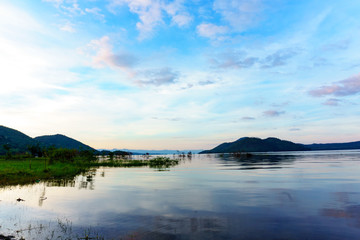 panorama landscape view of amazing beautiful island and water with blue sky and cloud when twilight in srinakarin dam,kanjanaburi,thailand. great scene of nature in the evening.