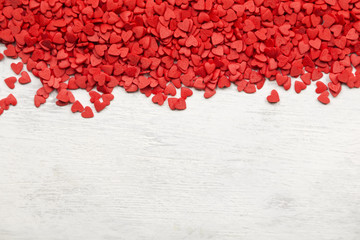 Red hearts on a white background. Top view, copy space