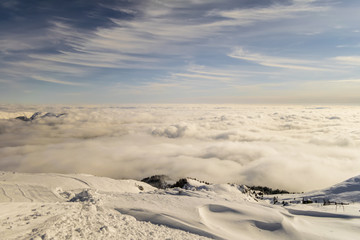 peaks of mountains above the clouds