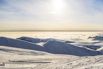 peaks of mountains above the clouds