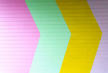 pattern of colorful arrow on wooden wall for abstract background.