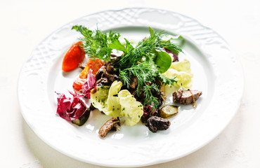 fresh salad on the white plate
