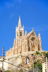 Fototapeta na wymiar View of Our Lady of Lourdes church on the hillside, Mgarr, Gozo, Malta.