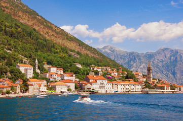 Fototapeta na wymiar Summer trip. Montenegro, view of Perast town with baroque stone palaces, churches and bell towers