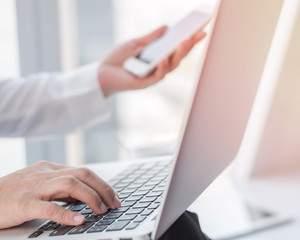 Digital lifestyle blog writer or business person using smart devices working on internet communication technology .