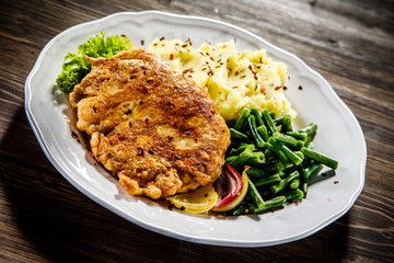Fried pork chop, mashed potatoes and green beans