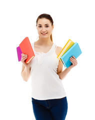 Young woman holding books on white background