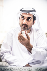 Arabian man drinking coffee