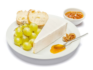 Piece of brie or camambert cheese on a white background