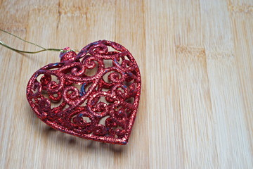 Red heart shape, on wooden surface