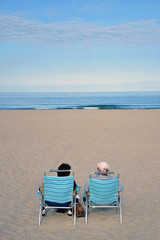 Fototapeta na wymiar retired couple on the beach