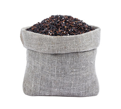 Black Rice In Burlap Bag Isolated On White