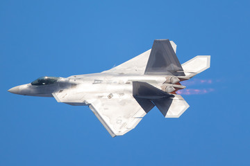 Fototapeta na wymiar F-22 Raptor in a very close view, with afterburners on