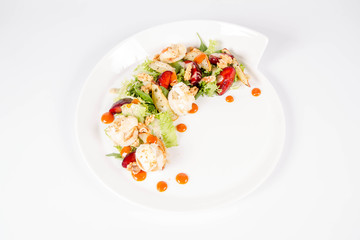 Starter: Mix salads, baked goat cheese, sea-buckthorn jam, caramelized pear with thyme, plum and roast nuts - on a white background