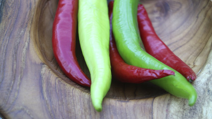 Peppers on wooden background