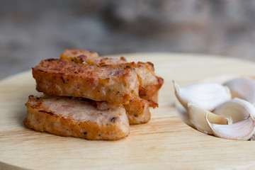 tasty slice grilled pork on wooden board,thai food
