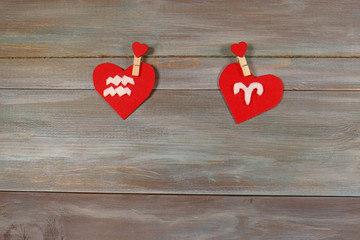 Aquarius and Aries are signs of the zodiac and heart. wooden bac