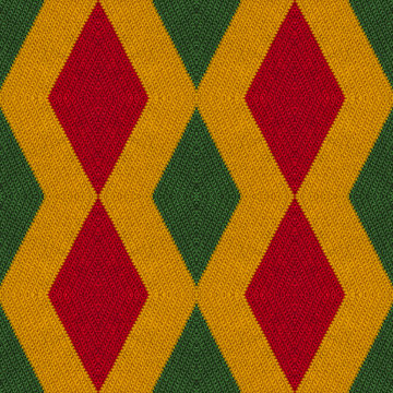 Reggae colors crochet knitted style background, top view. Collage with mirror reflection with rhombus. Seamless kaleidoscope montage for cushion, blanket, plaid, t-shirt graphics, cloth, poster.