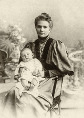 Vintage photo of the Russian woman with the small child on hands, the beginning of the 20th century - 188962574