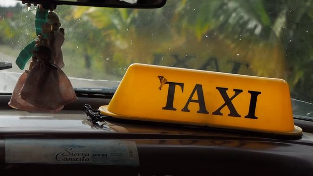 Riding in local taxi cab in Cuba