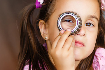 two happy little girls playing machine parts, playing with car parts.