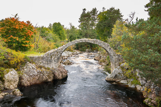 The ancient packhorse bridge at Carrbridge, in the Cairngorms National Park in Scotland in autumn
