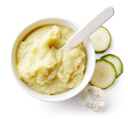 Cauliflower and zucchini baby puree isolated on white
