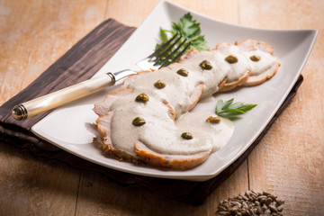 veal with tuna sauce and capers, selective focus