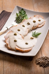 veal with tuna sauce and capers, selective focus
