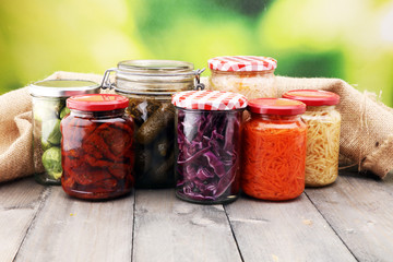 Jars with variety of pickled vegetables. Preserved food