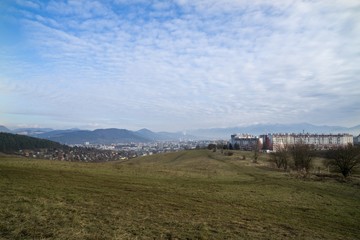 Fototapeta na wymiar Meadow with the view to the Zilina city. Slovakia