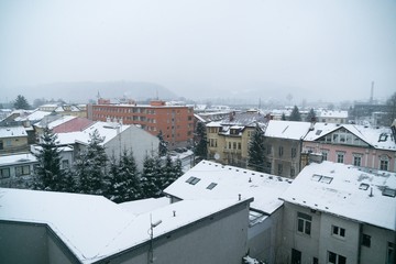 Fototapeta premium Snowfall in the town. Slovakia